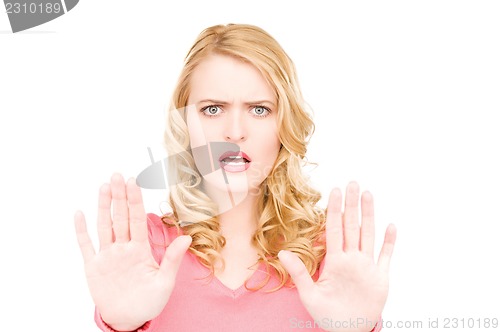 Image of woman making stop gesture