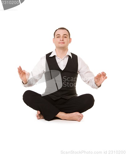 Image of businessman sitting in lotus pose