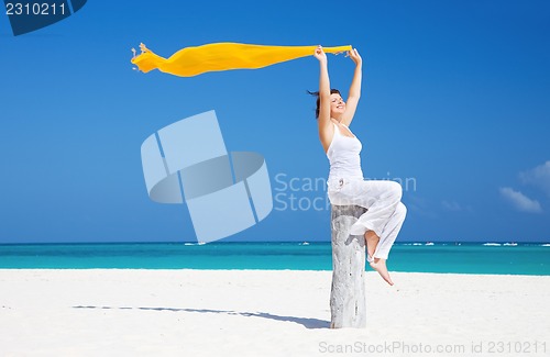 Image of happy woman on the beach