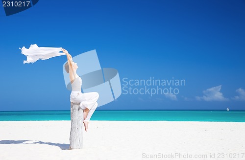 Image of happy woman on the beach