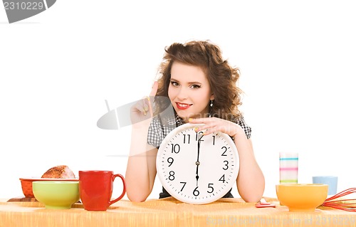 Image of young attractive woman in the kitchen