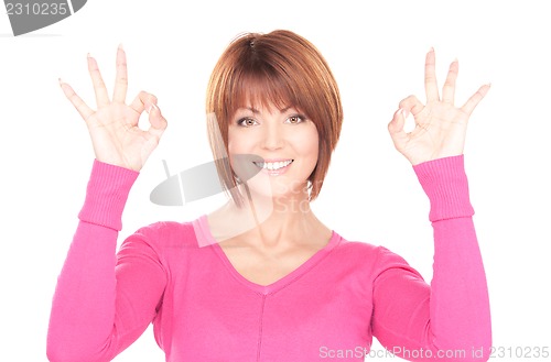 Image of lovely woman showing ok sign