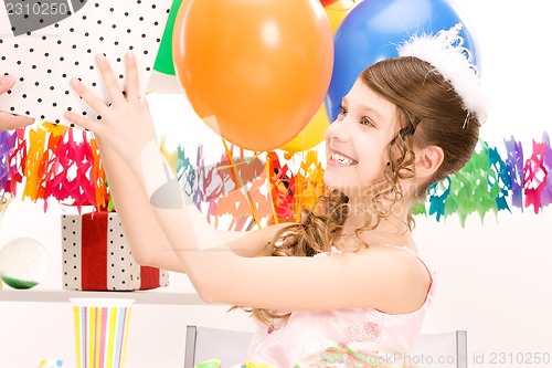 Image of party girl with balloons and gift box