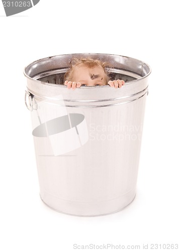 Image of baby in trash can