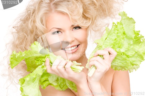 Image of happy woman with lettuce