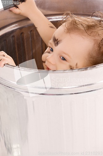 Image of baby in trash can