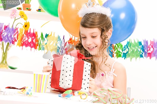 Image of party girl with balloons and gift box