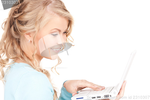 Image of happy woman with laptop computer