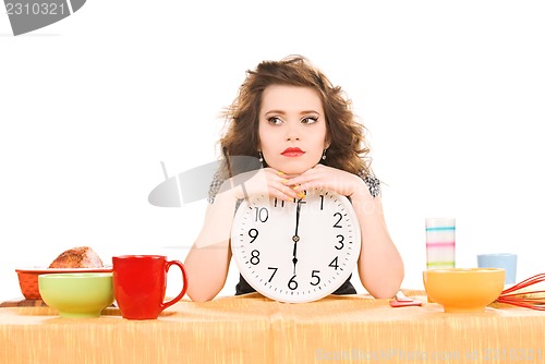 Image of young attractive woman in the kitchen