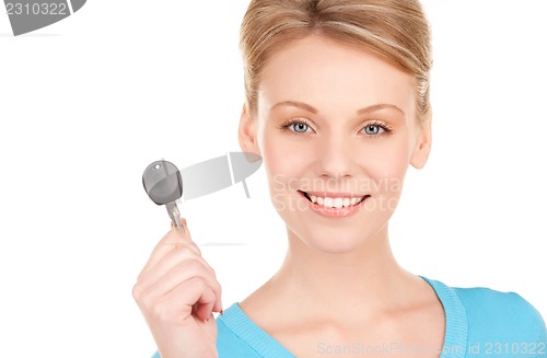 Image of happy woman with car key