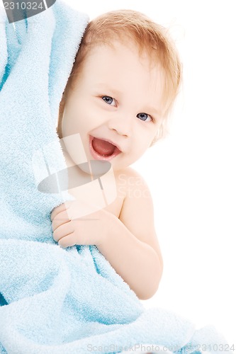 Image of baby with blue towel