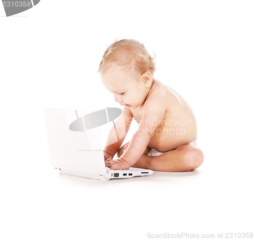 Image of baby boy with laptop computer