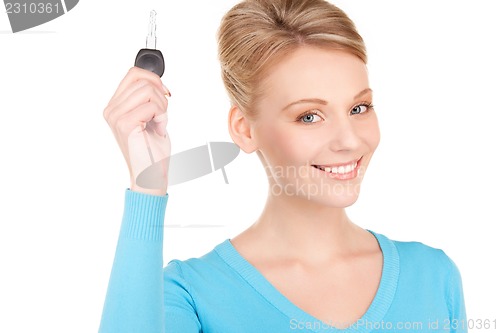 Image of happy woman with car key