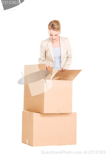 Image of businesswoman with boxes