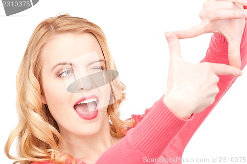 Image of lovely woman creating a frame with fingers