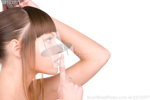 Image of finger on lips