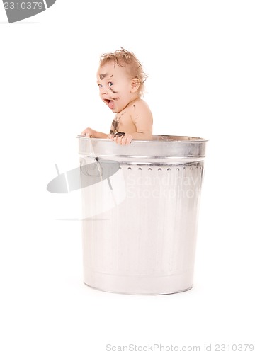 Image of baby in trash can