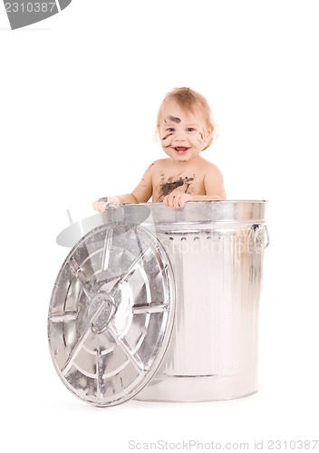 Image of baby in trash can