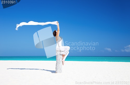 Image of happy woman on the beach