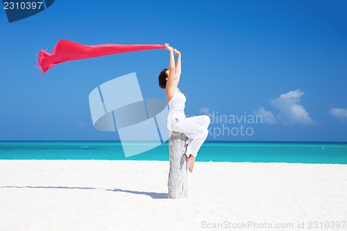 Image of happy woman on the beach