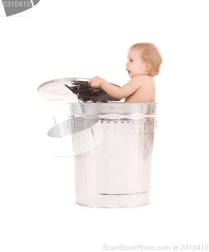 Image of baby in trash can