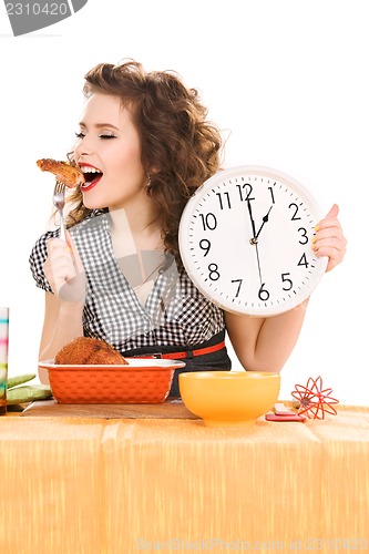 Image of young attractive woman in the kitchen