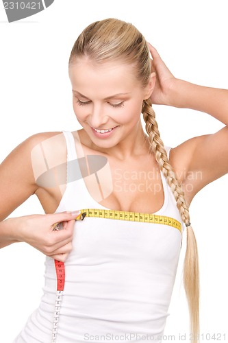 Image of beautiful woman with measure tape