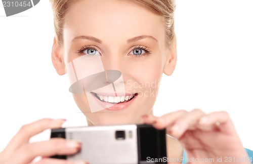 Image of happy woman using phone camera