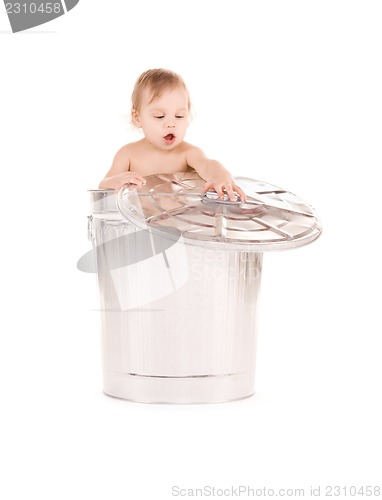 Image of baby in trash can