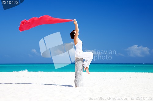 Image of happy woman on the beach