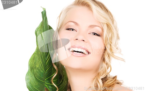 Image of woman with green leaf