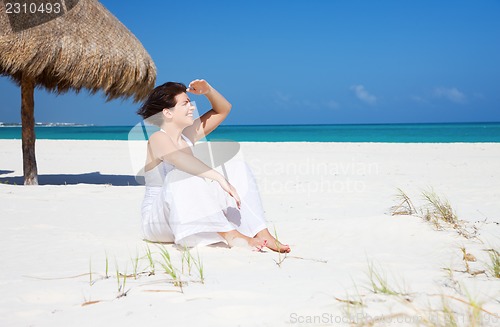 Image of happy woman on the beach