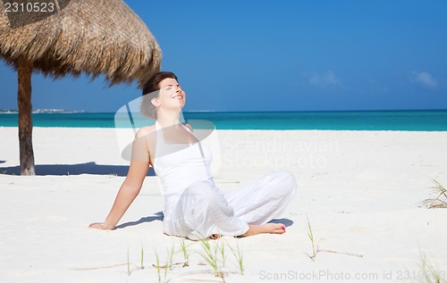 Image of happy woman on the beach