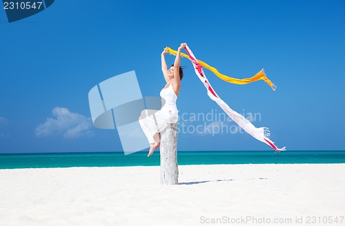 Image of happy woman on the beach