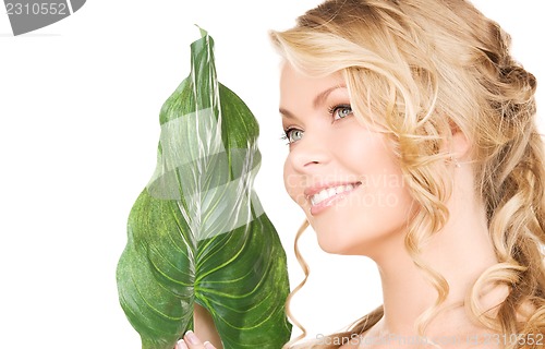 Image of woman with green leaf