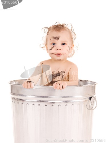 Image of baby in trash can