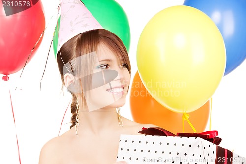 Image of party girl with balloons and gift box