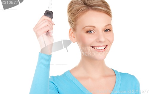 Image of happy woman with car key