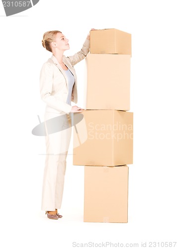 Image of businesswoman with boxes