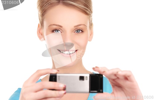 Image of happy woman using phone camera