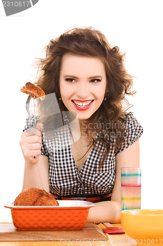 Image of young attractive woman in the kitchen