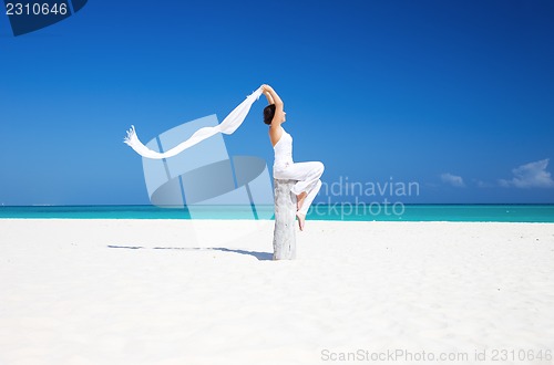 Image of happy woman on the beach
