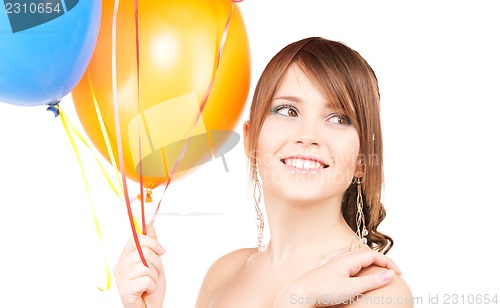Image of happy teenage girl with balloons