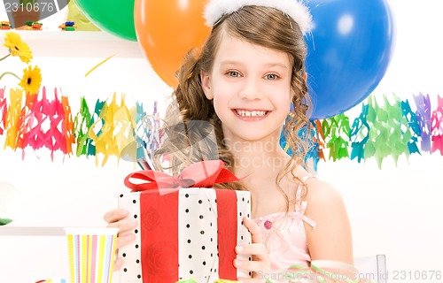 Image of party girl with balloons and gift box