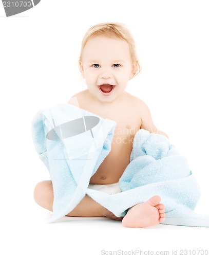 Image of baby with blue towel