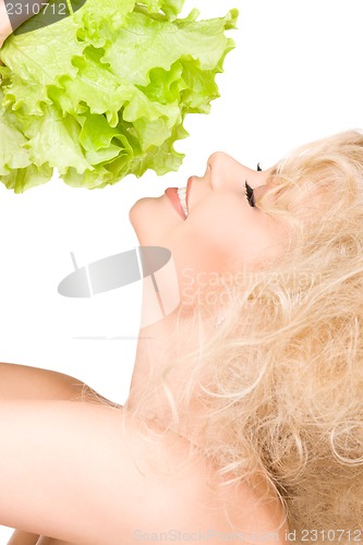 Image of happy woman with lettuce