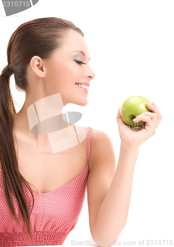 Image of young beautiful woman with green apple