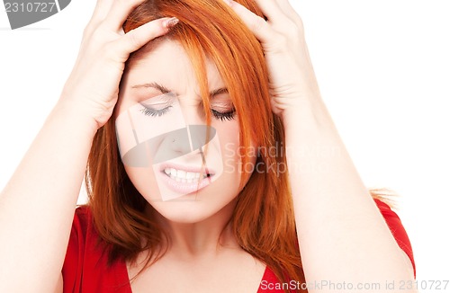 Image of unhappy redhead woman