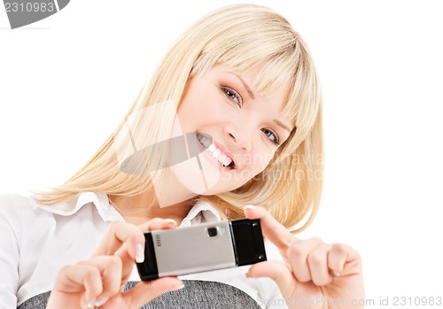 Image of happy woman using phone camera