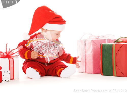 Image of santa helper baby with christmas gifts